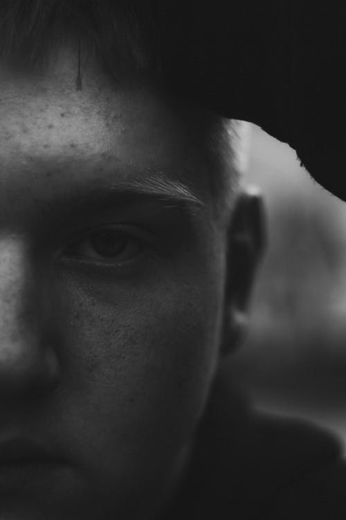 Grayscale Photo of Man's Face