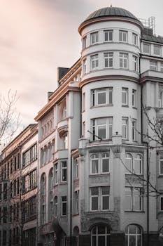 Elegant historic building in Hamburg captured at dusk, showcasing classic architecture.