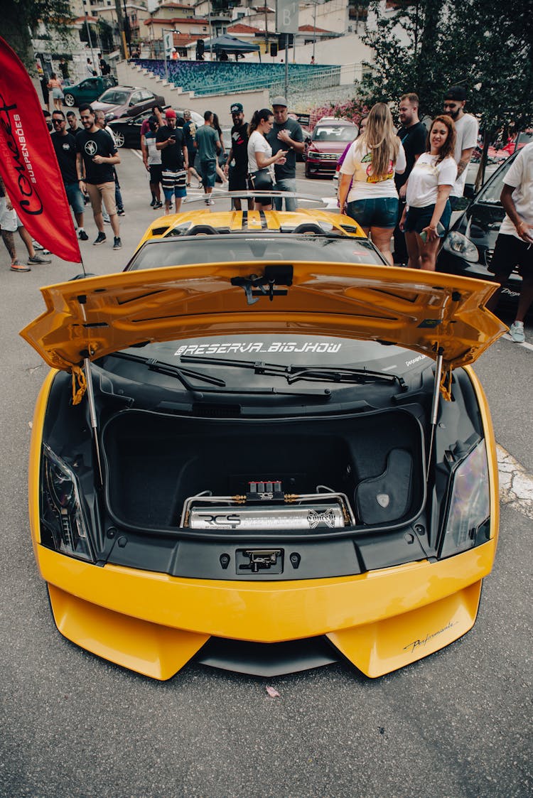 A Yellow Lamborghini Gallardo Spyder With An Open Hood