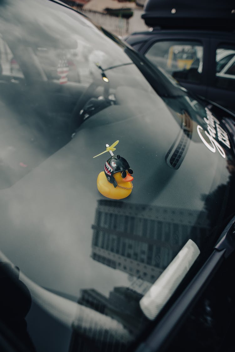 Yellow Rubber Duck On Car Dashboard