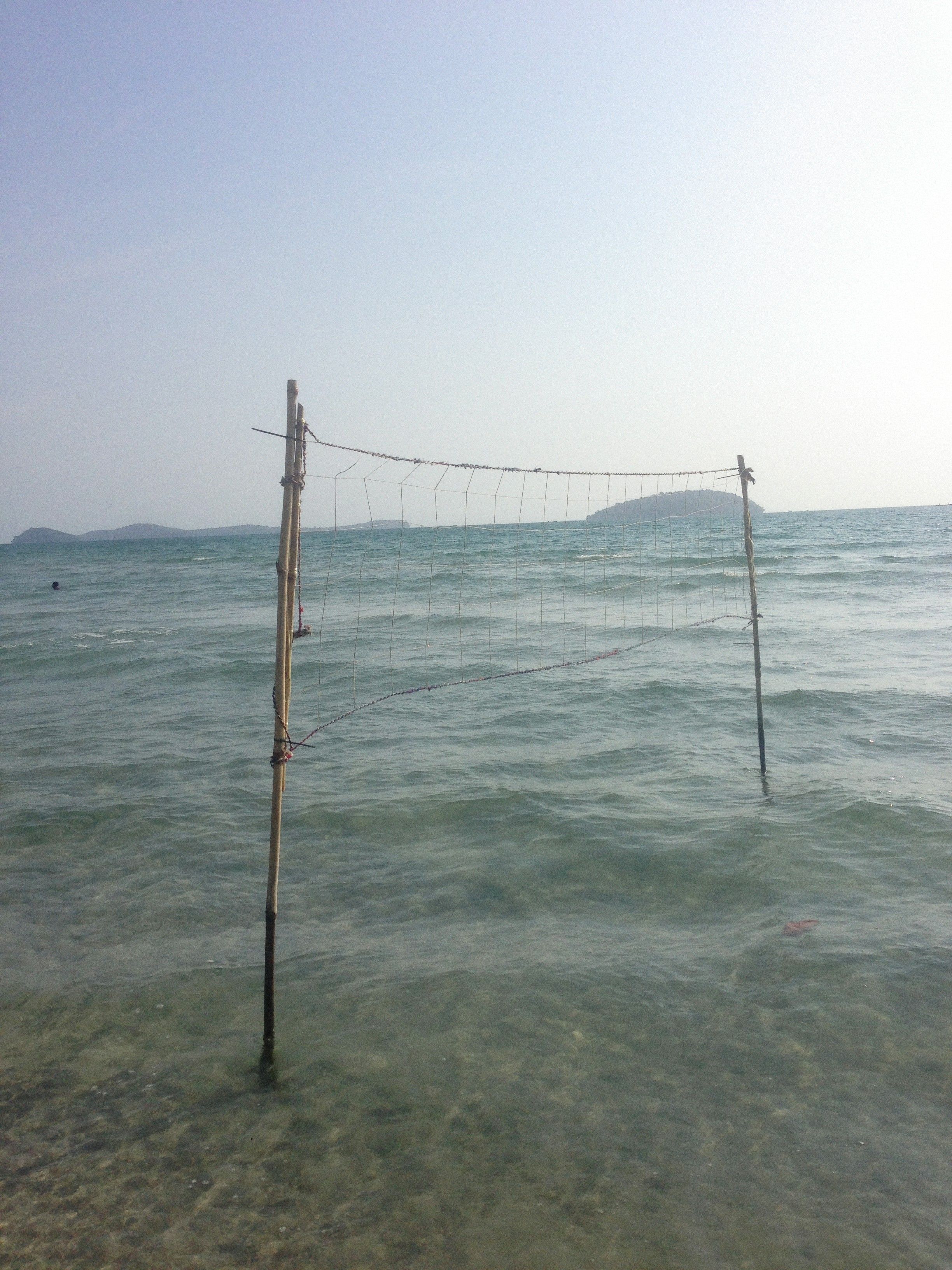 Photo of a Net Sport Standing in Water · Free Stock Photo
