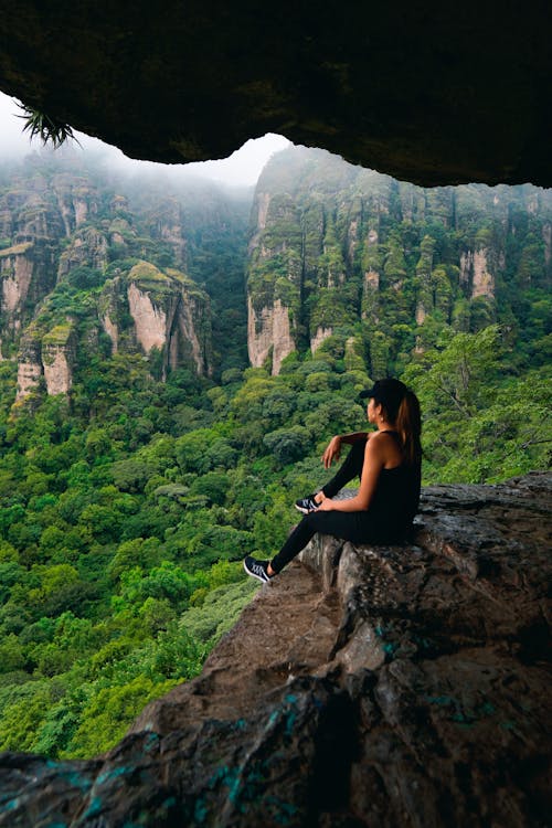 A Woman on the Edge of a Cliff