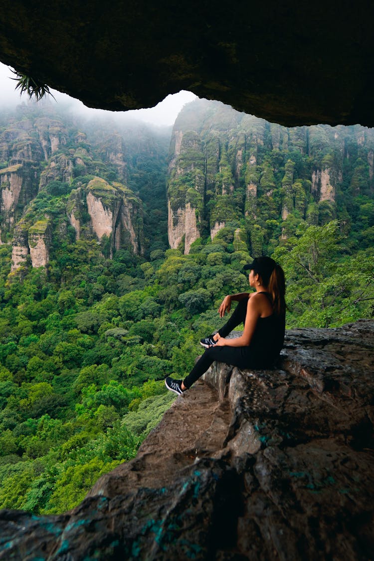 A Woman On The Edge Of A Cliff