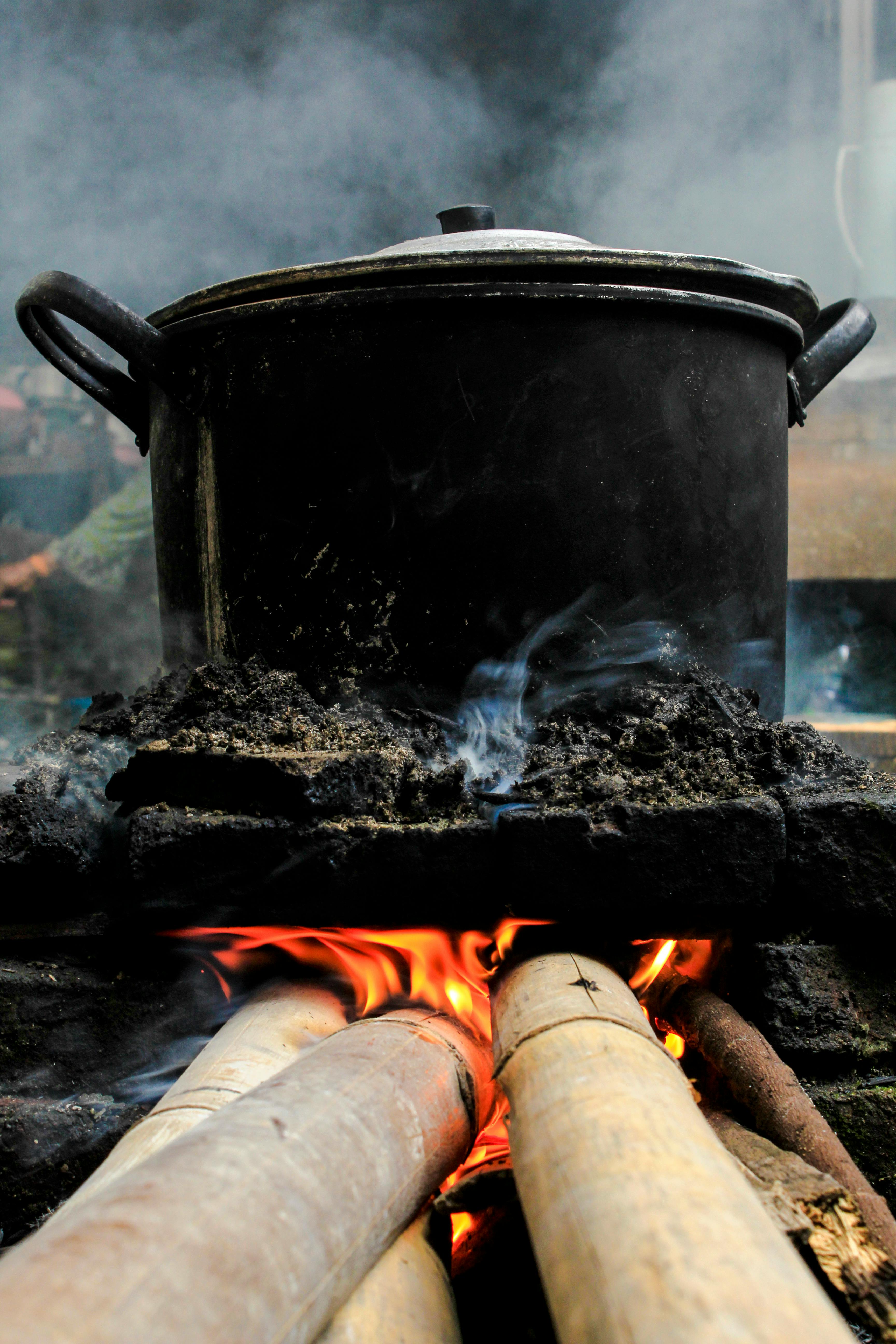 Cooking Large Pot Over The Fire Outdoors Stock Photo, Picture and Royalty  Free Image. Image 79928181.