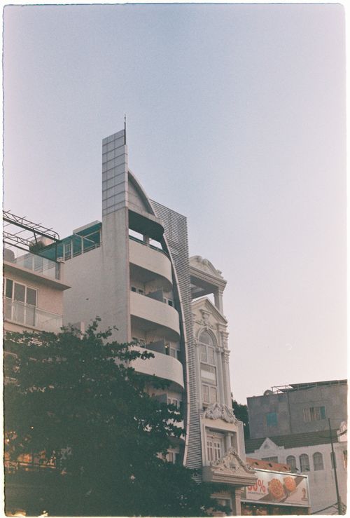 Free A unique blend of modern and classic architectural styles in an urban setting. Stock Photo