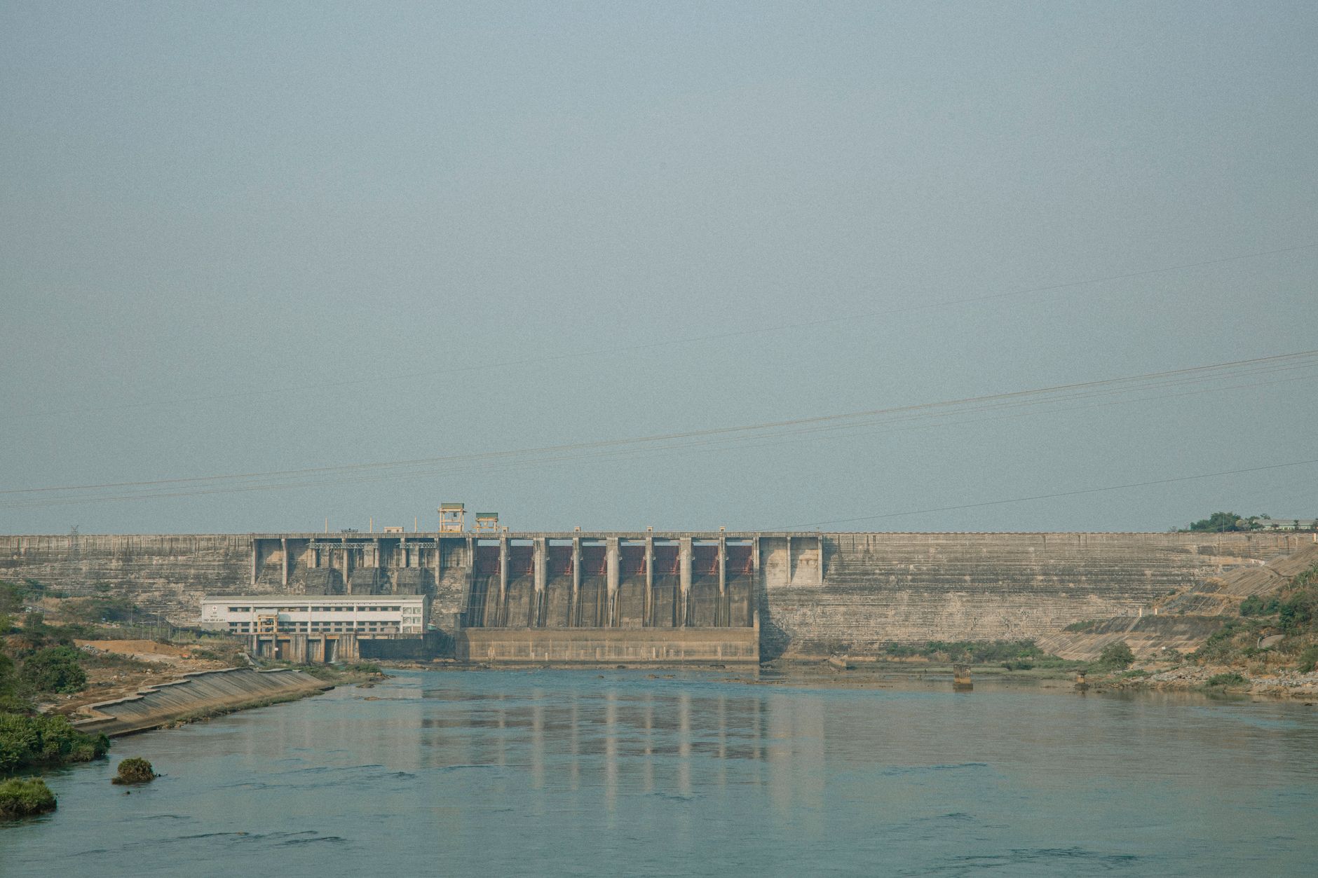 A serene view of a dam with a tranquil river in Gia Lai, Vietnam.