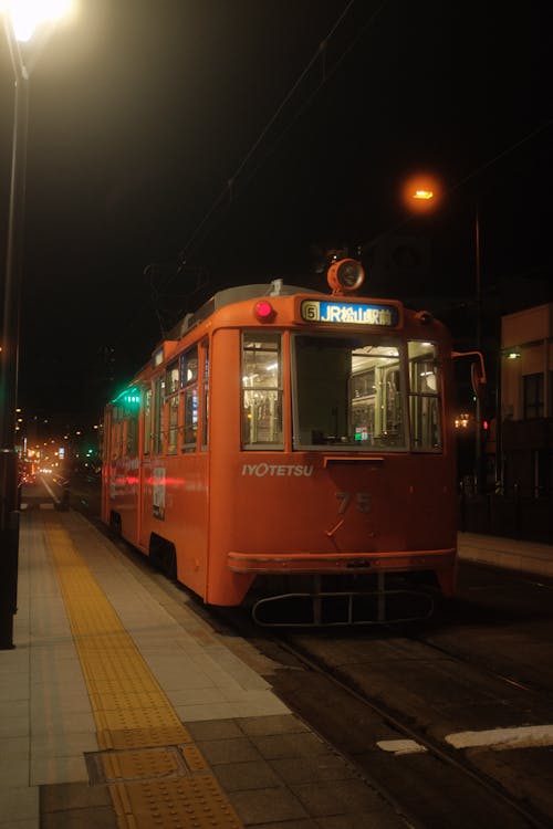 Free Red Tram on Road During Night Time Stock Photo