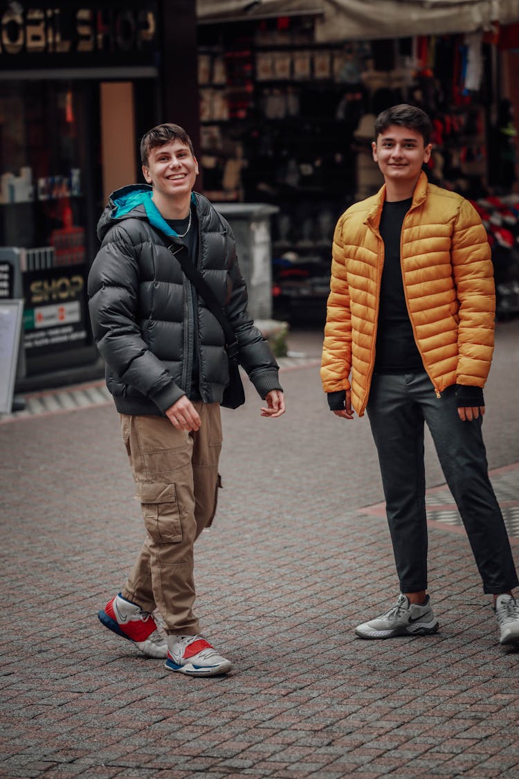 Men Standing Beside Shopping Stalls