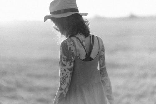 Free A Tattooed Woman Hat Stock Photo