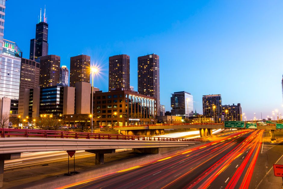 Chicago skyline with illuminated highways at twilight