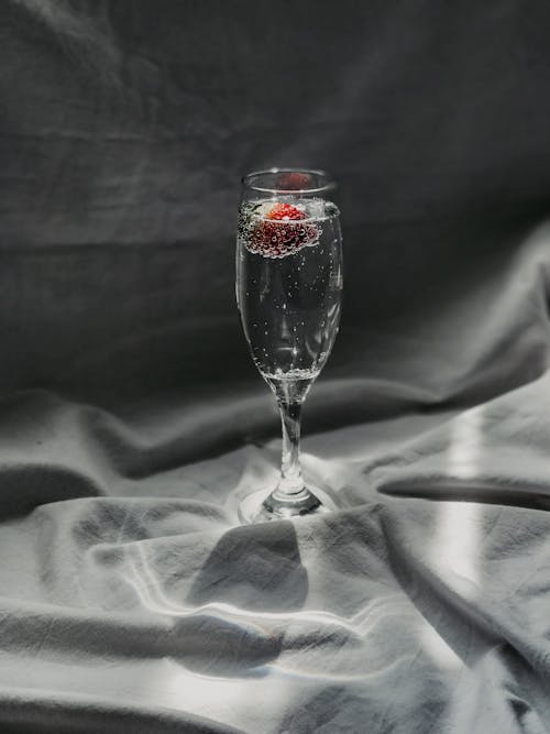 Free Champagne Glass with Sparkling Water and Strawberry Stock Photo