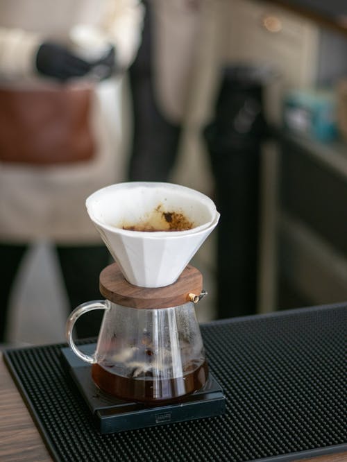 White Coffee Filter on Clear Glass Mug