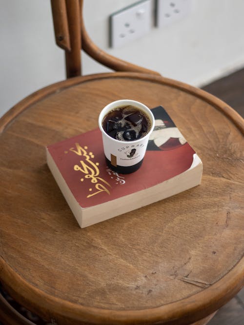 Coffee Cup on Top of a Book