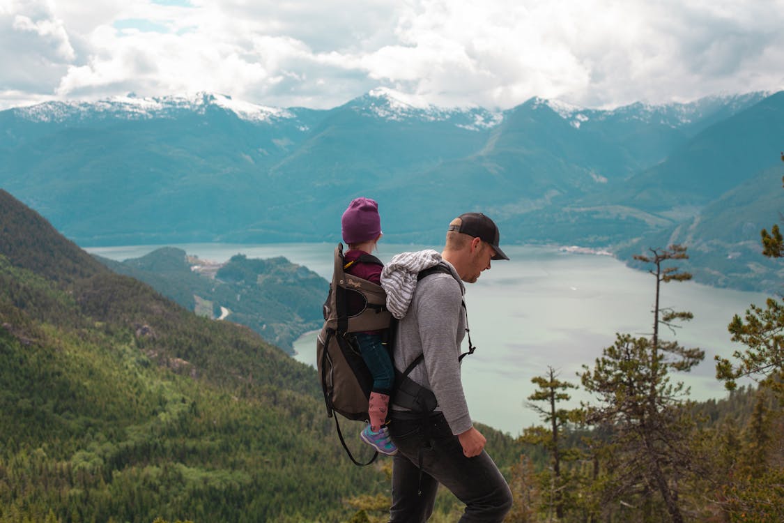 Free Father and Child Hiking in a Mountain Landscape Stock Photo