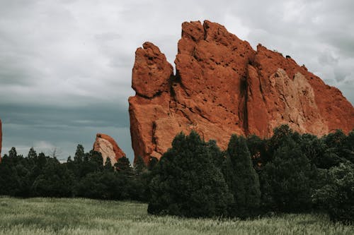 Brown Rock Formation Near Green Trees