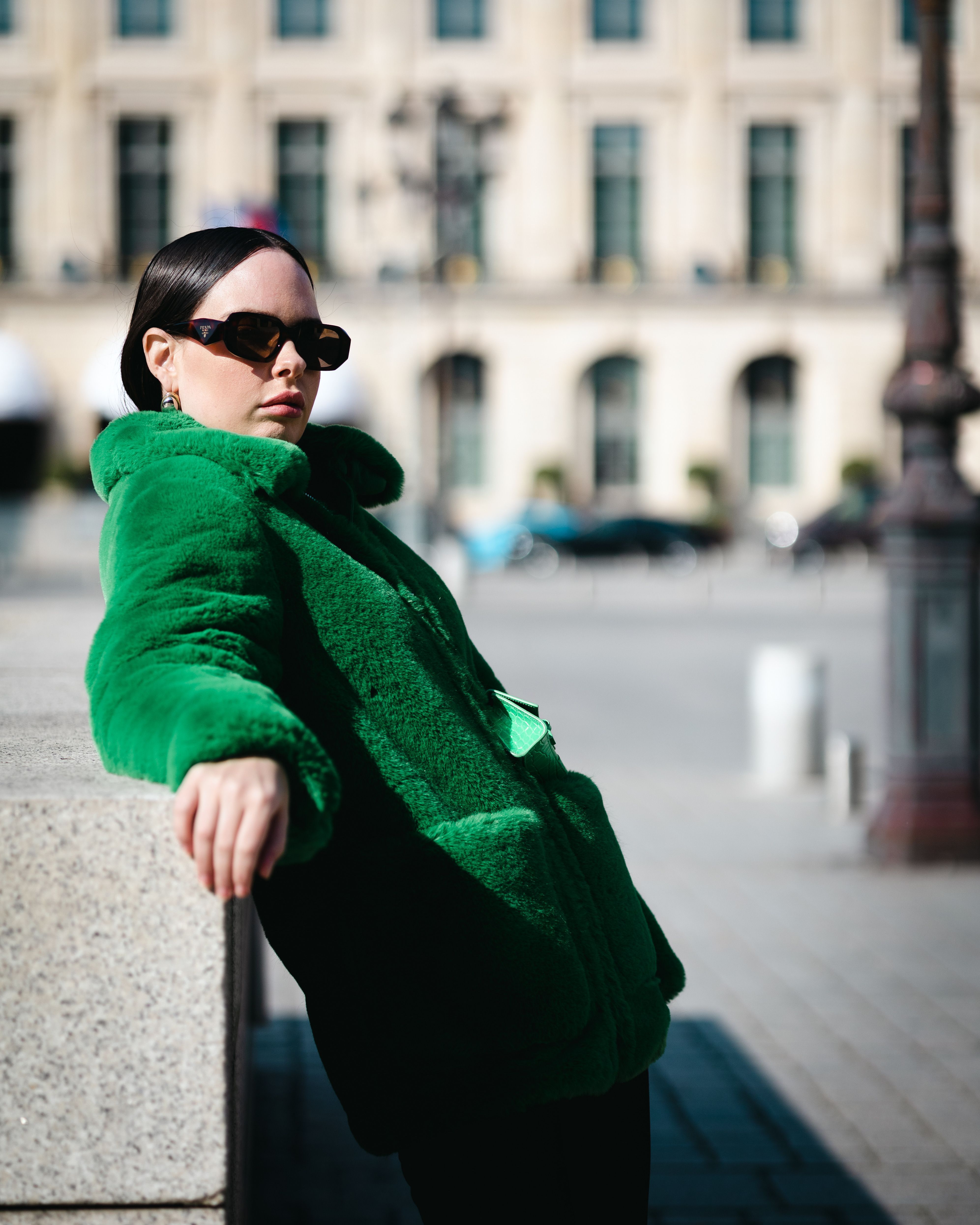 Woman in Green Jacket Leaning on a Fence · Free Stock Photo