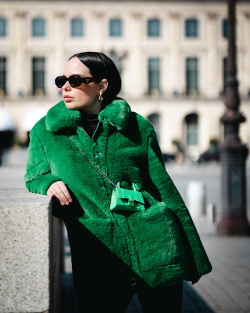 Free Woman in Green Coat Wearing Black Sunglasses Stock Photo