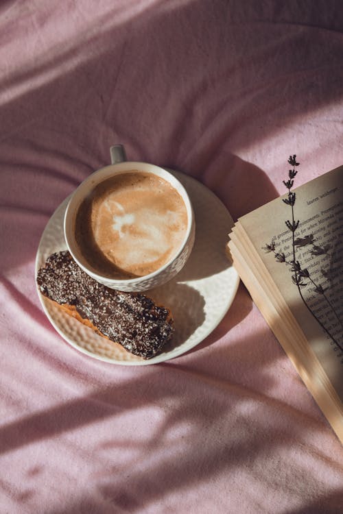 White Ceramic Mug on White Ceramic Saucer