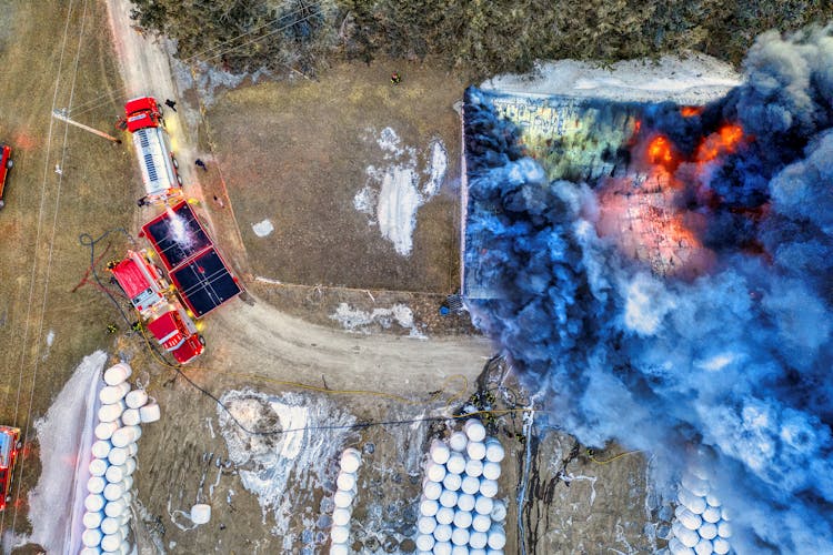 
Top View Of Fire Trucks Near Burning Warehouse