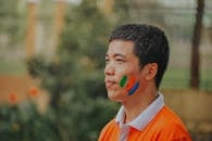 Man Wearing White and Orange Polo Shirt
