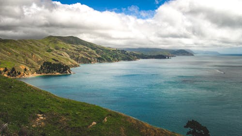 Clouds over Hills on Sea Shore