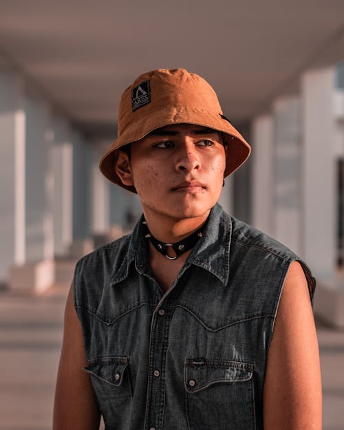 Free A Portrait of a Young Man in a Bucket Hat Stock Photo