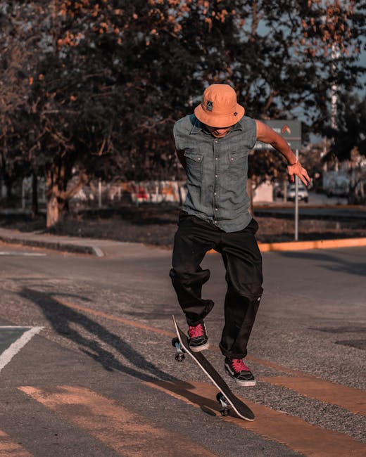 A skateboarder performs an ollie in an outdoor park setting, showcasing skill and balance.