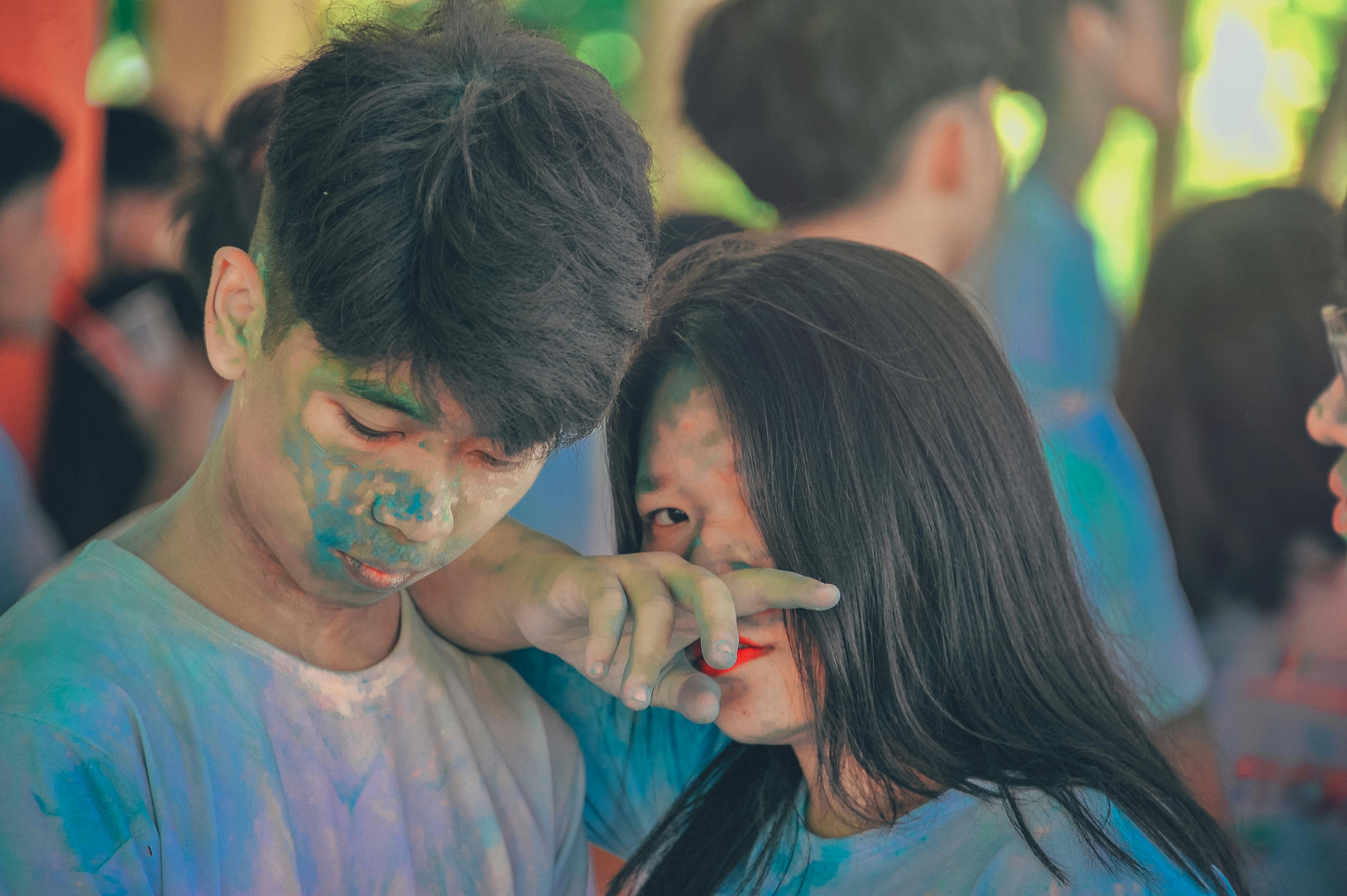 man and woman covered in blue powder