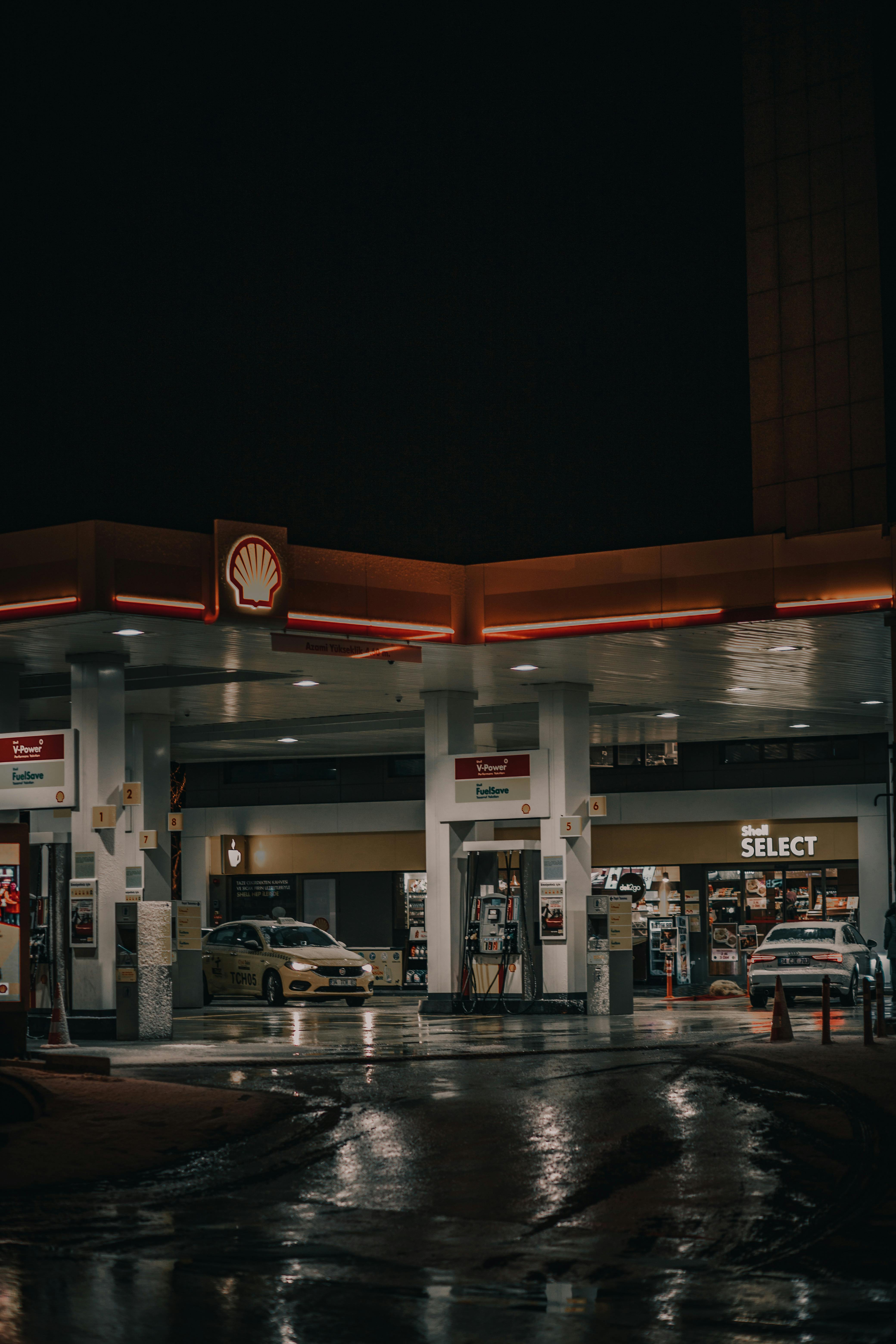 ITAP of a gas station on a rainy night (taken with original Google Pixel  from inside my car)