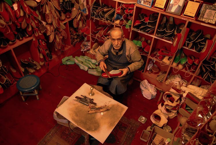 Elderly Man Working As A Shoemaker