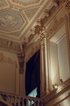 A detailed view of an ornate interior ceiling with architectural details in a historical mansion in Istanbul, Turkey.