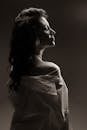 Woman Posing in White Shirt with Uncovered Shoulder