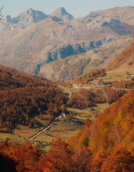 Scenic autumn landscape of Lëpushë Valley with vibrant fall foliage in Shkodër County, Albania.