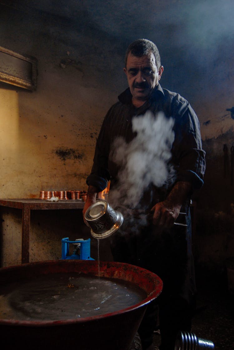 Man Cooking In Huge Pot