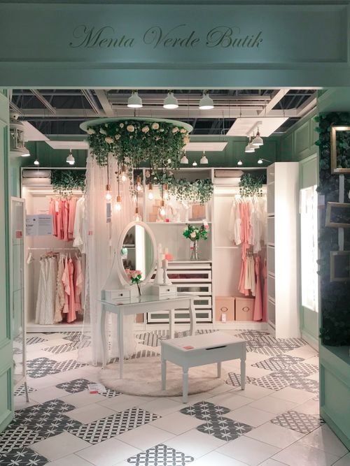 Free Stylish boutique interior showcasing elegant fashion displays with a classic decor style. Stock Photo