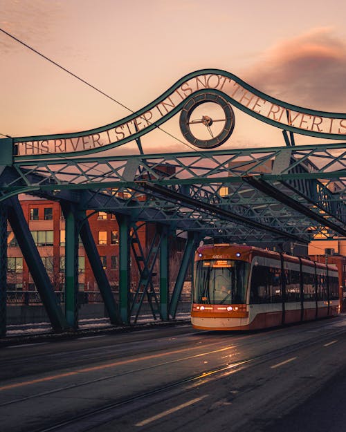 Orange and White Train on the Street