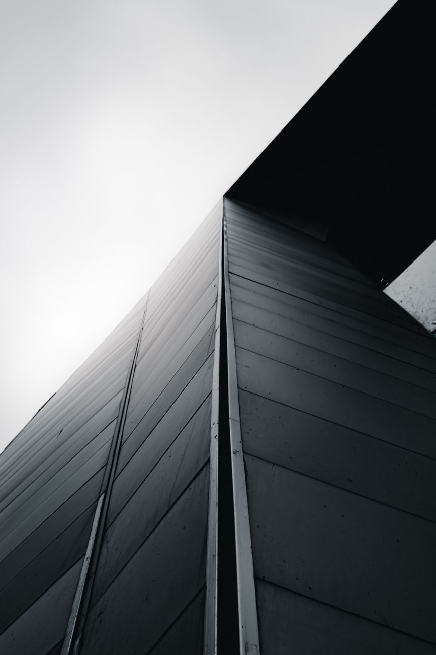 Dynamic view of modern architecture showcasing bold geometric patterns and minimalistic design.