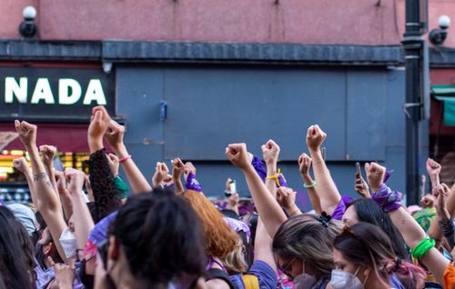 Free Group of protestors in Mexico City raising fists in unity and support for equal rights. Stock Photo