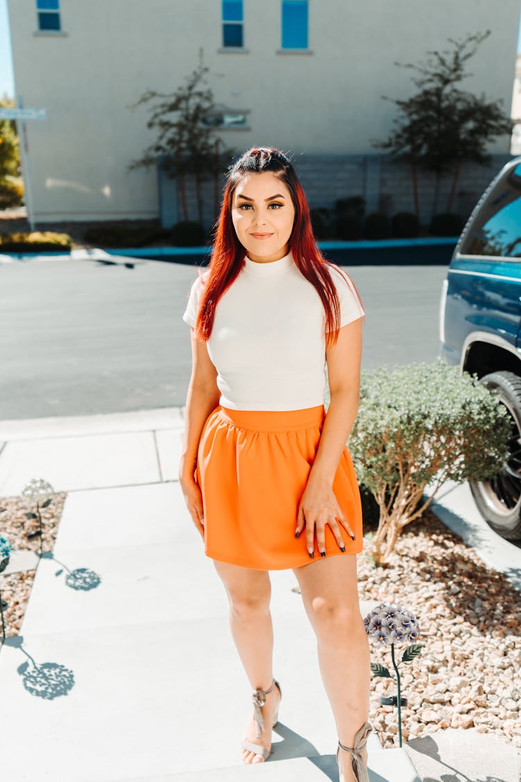 A Woman Wearing Orange Skirt