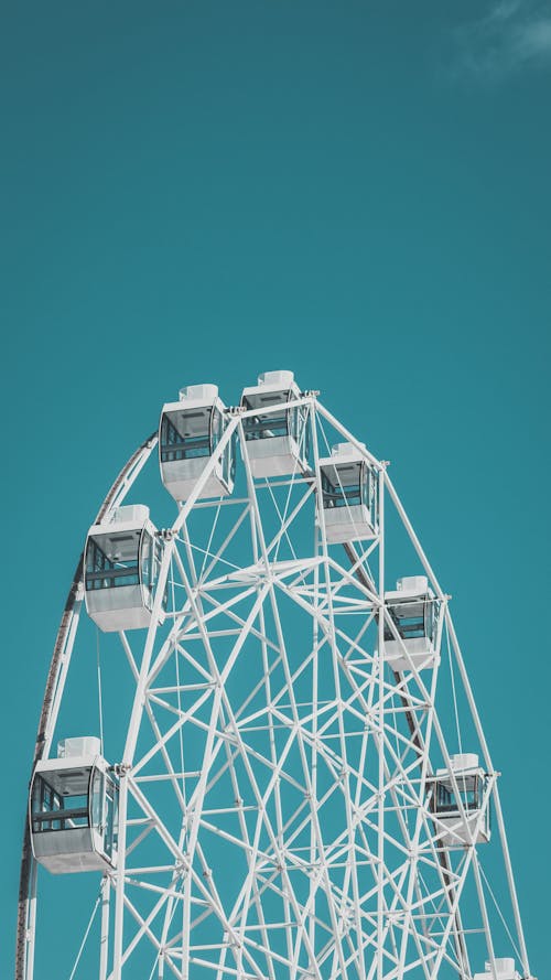 Clear Blue Sky over a White Ferris Wheel