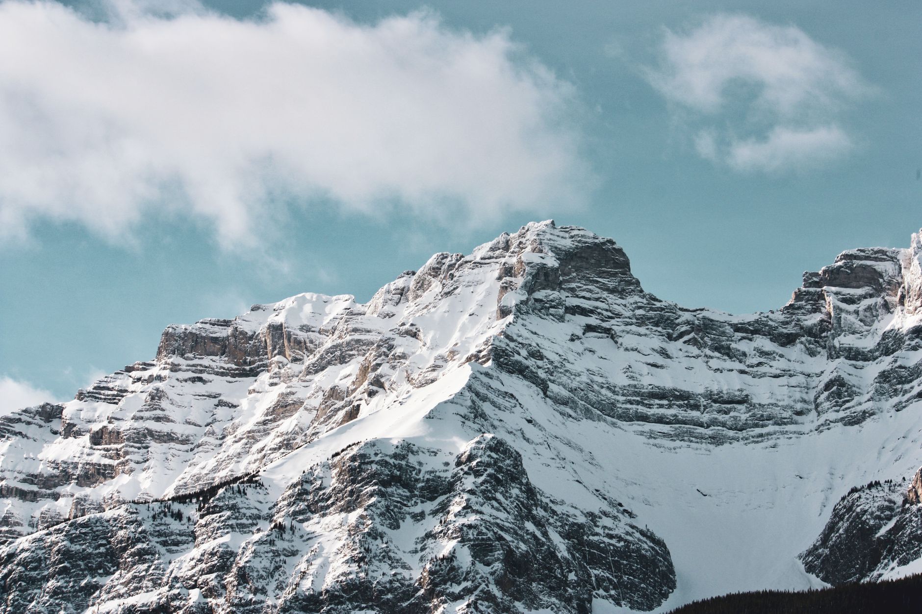 Stunning view of snow-covered mountain peaks in Banff, Alberta, Canada.