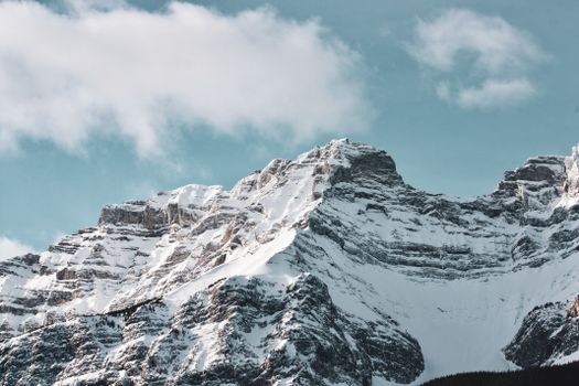 Stunning view of snow-covered mountain peaks in Banff, Alberta, Canada.