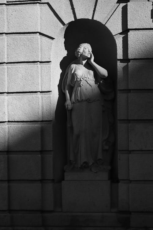 Grayscale Photo of a Statue