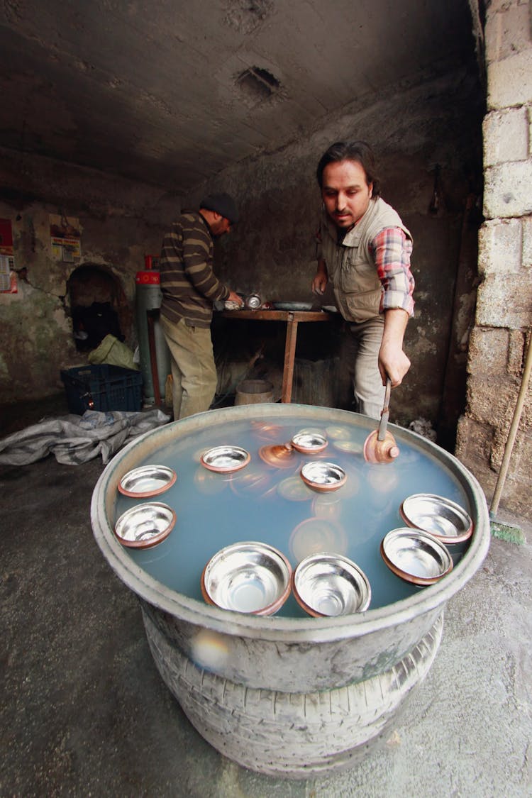 Metal Lids Floating On A Basin