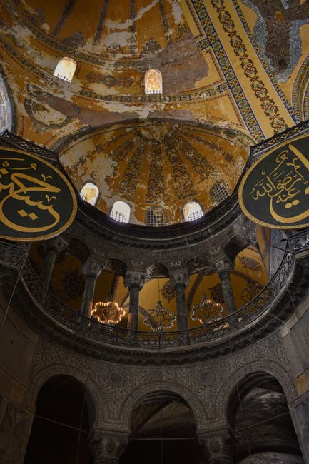 Stunning view of the ornate ceiling inside Hagia Sophia, showcasing historic Ottoman architecture.