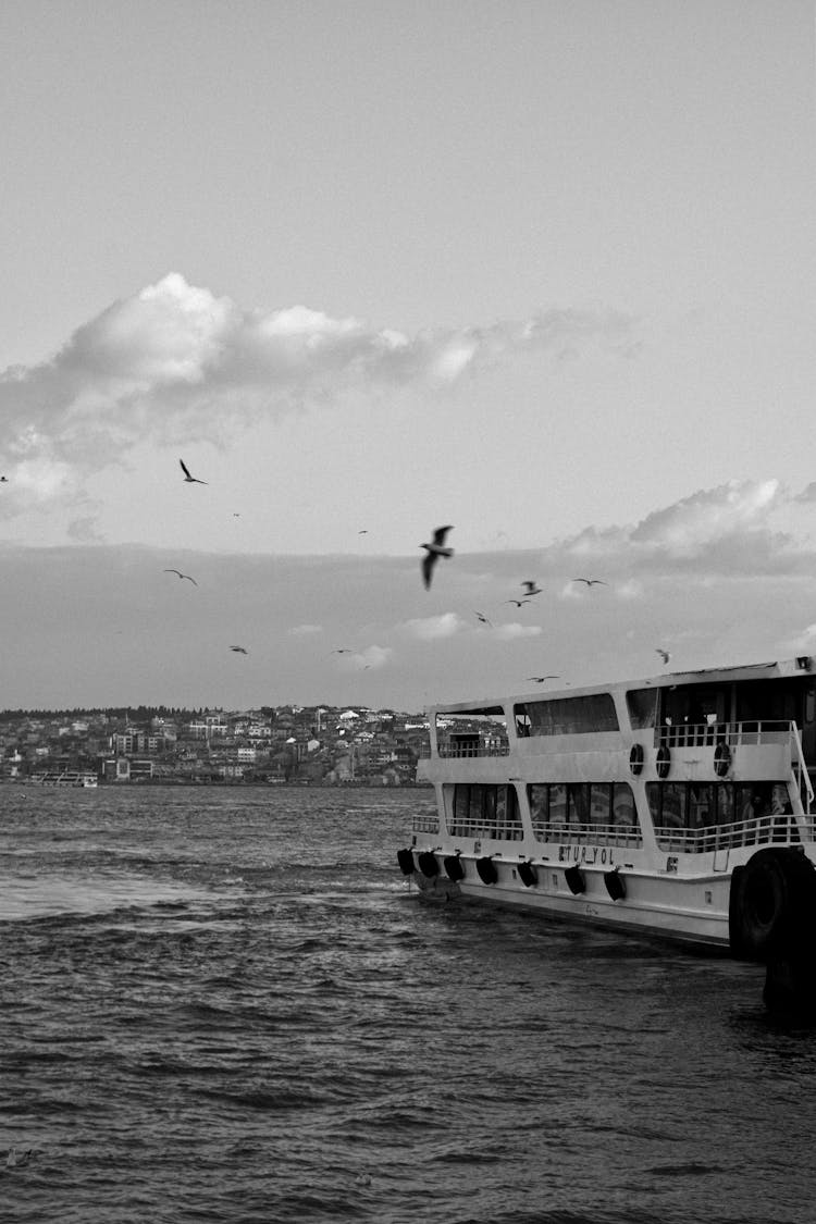 Black And White Photo Of Ferry Sailing On River