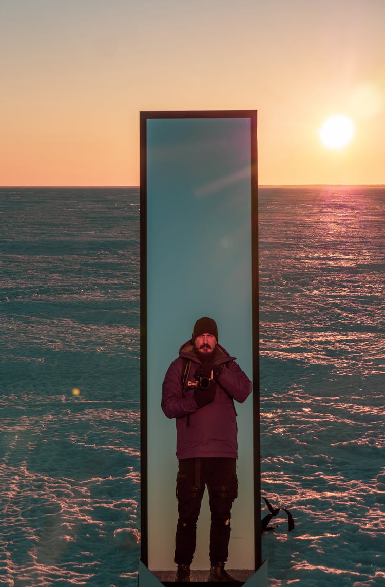 Reflection Of A Man In A Mirror