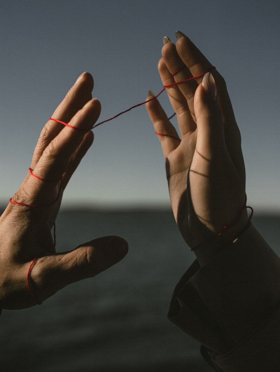 Hands of Couple Connected with Red String · Free Stock Photo