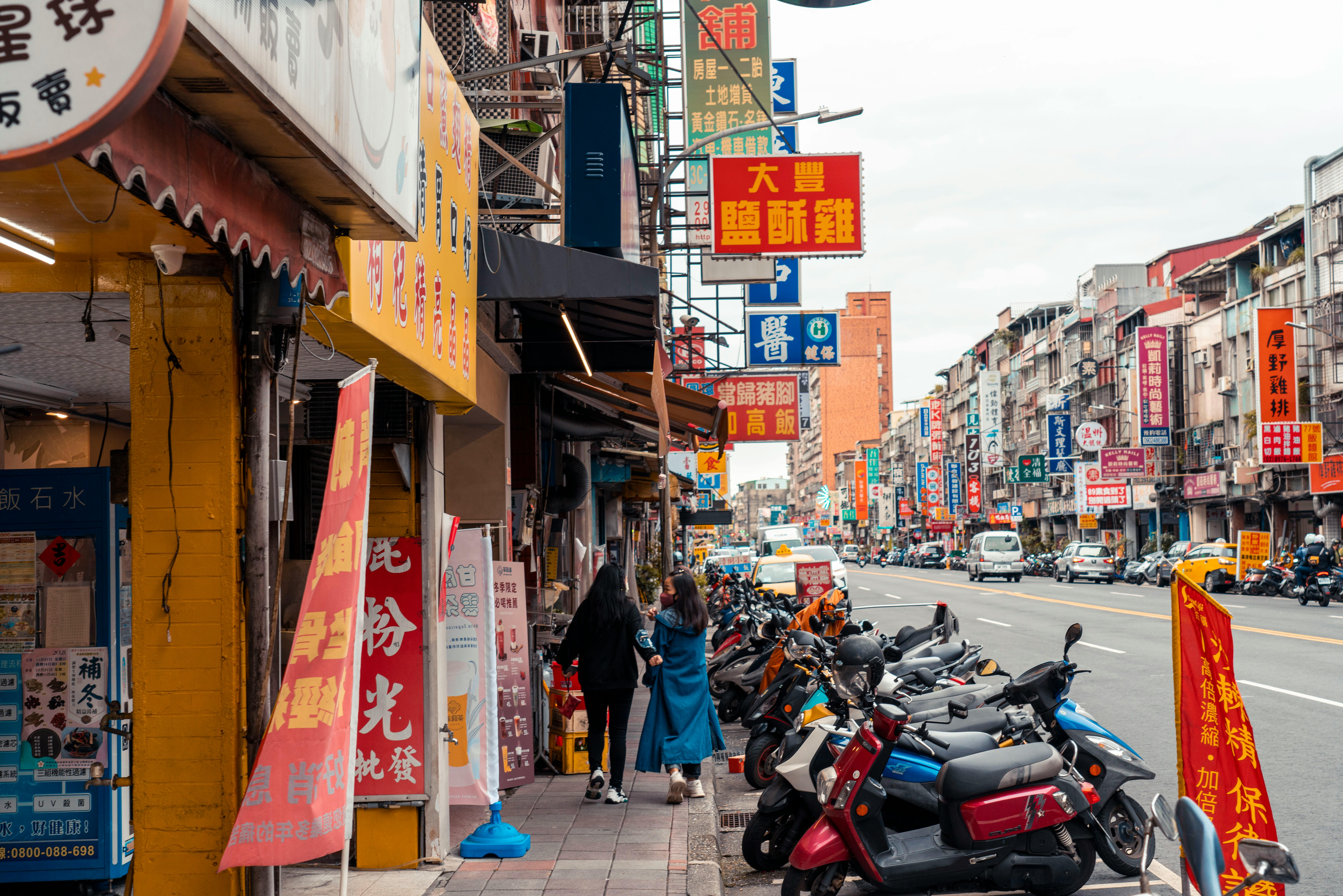 busy retail street with diverse storefronts - site selection and analysis