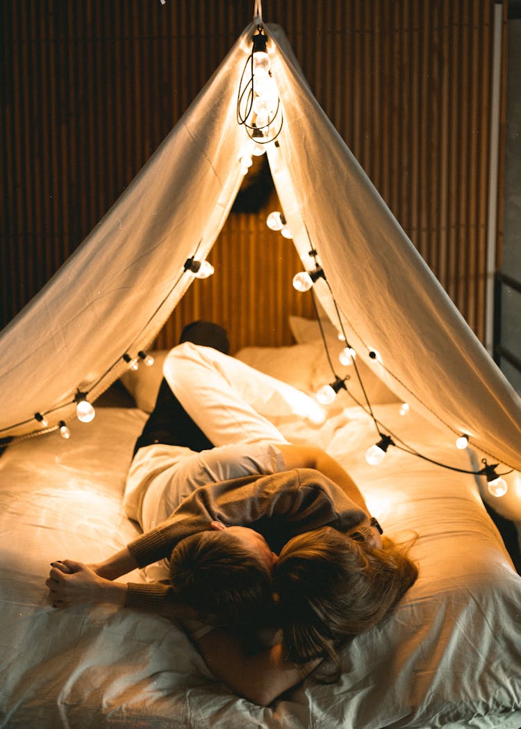 Couple Cuddling While In Bed